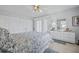 Cozy bedroom with a large closet, marble-topped dresser, and ceiling fan at 11923 Boynton Ln # B, New Port Richey, FL 34654