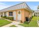 Cozy single-story home with well-kept lawn, a decorative wreath, and convenient sidewalk access at 11923 Boynton Ln # B, New Port Richey, FL 34654