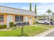 Charming home exterior featuring a well-manicured lawn, inviting entrance, and convenient carport at 11923 Boynton Ln # B, New Port Richey, FL 34654