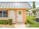 Inviting home entrance with a cheerful sunflower wreath, stylish details, and a manicured green lawn at 11923 Boynton Ln # B, New Port Richey, FL 34654