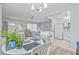 Spacious living area with open-concept design, connecting the kitchen, dining area, and living room seamlessly at 11923 Boynton Ln # B, New Port Richey, FL 34654