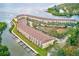 Aerial view of waterfront condo community, lush landscape, and private boat docks at 150 Brent Cir, Oldsmar, FL 34677