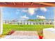 Beautiful water view from the backyard with tropical landscaping at 150 Brent Cir, Oldsmar, FL 34677
