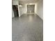 Spacious garage with sealed floor, offering ample space for parking and storage at 150 Brent Cir, Oldsmar, FL 34677