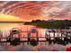 Beautiful sunset view of the water with private boat docks at 150 Brent Cir, Oldsmar, FL 34677