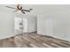 Spacious bedroom with a large closet, modern flooring, and a sliding glass door at 456 Sandlewood Dr, Venice, FL 34293