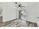 Bright bedroom with neutral walls, stylish flooring, and a sliding glass door to the patio at 456 Sandlewood Dr, Venice, FL 34293