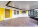 Bright and airy patio with yellow accents, tile floors, and a screened-in lanai for outdoor enjoyment at 456 Sandlewood Dr, Venice, FL 34293