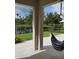 Inviting backyard featuring a hammock with views of the serene lake and lush greenery at 5150 San Palermo Dr, Bradenton, FL 34208