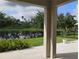 Relaxing backyard with a column view overlooking a serene lake surrounded by lush greenery at 5150 San Palermo Dr, Bradenton, FL 34208