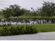 Home's lush backyard overlooking a serene pond at 5150 San Palermo Dr, Bradenton, FL 34208