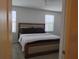 Bedroom showcasing a large bed, neutral color scheme, and natural light at 5150 San Palermo Dr, Bradenton, FL 34208