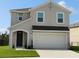 Charming two-story home with a well-manicured lawn, and a two car garage at 5150 San Palermo Dr, Bradenton, FL 34208