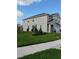 Exterior view of a two-story home showcasing a well-manicured lawn and tidy landscaping at 5150 San Palermo Dr, Bradenton, FL 34208