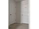 Hallway view of two doors, one leading to the laundry room at 5150 San Palermo Dr, Bradenton, FL 34208