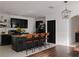 Modern eat-in kitchen with an island bar and black cabinets at 5150 San Palermo Dr, Bradenton, FL 34208