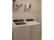 Laundry room showcasing a front load washer and dryer at 5150 San Palermo Dr, Bradenton, FL 34208