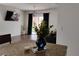 Bright living room with a TV and sliding glass door at 5150 San Palermo Dr, Bradenton, FL 34208