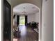 Open-concept living room with hardwood floors, a modern sofa, and a view of backyard at 5150 San Palermo Dr, Bradenton, FL 34208
