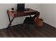 Office space with a wooden desk, modern chair, and storage basket for a modern style at 5150 San Palermo Dr, Bradenton, FL 34208