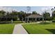 Community playground with a picnic shelter and winding sidewalk at 5150 San Palermo Dr, Bradenton, FL 34208