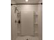 Modern shower with white tiling and built-in shelving at 5150 San Palermo Dr, Bradenton, FL 34208