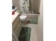 Cozy bathroom with a white toilet, tub-shower combination, and matching green mats on tile floor at 6640 121St Ave # 1, Largo, FL 33773