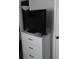 Bedroom furniture with a television and lamp at 6640 121St Ave # 1, Largo, FL 33773