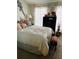 Comfortable bedroom featuring a well-made bed, accent decorations, and warm lighting at 6640 121St Ave # 1, Largo, FL 33773