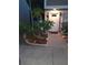 Charming home featuring a landscaped front yard with walkway, lighting, and updated windows and shutters at 6640 121St Ave # 1, Largo, FL 33773