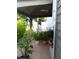 Charming backyard gazebo on a tile patio surrounded by lush plants and greenery at 6640 121St Ave # 1, Largo, FL 33773