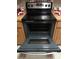 Open oven in kitchen with countertop appliances ready for cooking and baking at 6640 121St Ave # 1, Largo, FL 33773