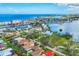 Aerial view of the neighborhood, showcasing the homes, landscaping and proximity to the water at 811 Laguna Dr, Venice, FL 34285