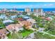 Beautiful aerial view of the upscale neighborhood with lush greenery and stunning ocean views at 811 Laguna Dr, Venice, FL 34285