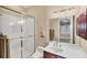 Bathroom featuring a glass-enclosed shower, wood vanity, and a large mirror at 811 Laguna Dr, Venice, FL 34285