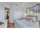 Bedroom with a closet and a window, offering ample natural light and storage space at 811 Laguna Dr, Venice, FL 34285