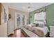 Bright bedroom with french doors, a ceiling fan, and a view of the yard at 811 Laguna Dr, Venice, FL 34285