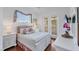 Inviting bedroom with wood floors, natural light, and a relaxing atmosphere at 811 Laguna Dr, Venice, FL 34285