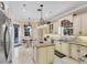 Spacious kitchen with breakfast area and access to the pool at 811 Laguna Dr, Venice, FL 34285