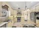Well-equipped kitchen with stainless steel appliances and granite countertops at 811 Laguna Dr, Venice, FL 34285