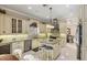 Charming kitchen featuring granite counters and stainless steel appliances at 811 Laguna Dr, Venice, FL 34285