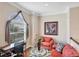 Cozy living room with comfortable seating, a desk, and a large window view at 811 Laguna Dr, Venice, FL 34285