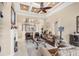 Bright living room boasts high ceilings, stylish decor, and staircase view at 811 Laguna Dr, Venice, FL 34285
