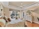 Cozy bedroom boasting hardwood floors, a ceiling fan, and a bright window at 811 Laguna Dr, Venice, FL 34285
