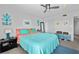 Stylish bedroom features bright decor, carpet floors, and a ceiling fan at 9860 62Nd N Ter # 1047, St Petersburg, FL 33708