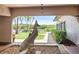 Covered courtyard with stone statue and serene water view at 9860 62Nd N Ter # 1047, St Petersburg, FL 33708