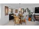 Bright dining area with a glass table, wicker chairs, and tasteful decorations, perfect for gatherings at 9860 62Nd N Ter # 1047, St Petersburg, FL 33708