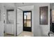 The entryway features a washer/dryer, and a black security door that allows natural light to brighten the interior at 9860 62Nd N Ter # 1047, St Petersburg, FL 33708