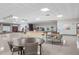 Large event space with a stage, piano, tables, and chairs, perfect for gatherings and performances at 9860 62Nd N Ter # 1047, St Petersburg, FL 33708