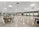 Expansive event space with tables and chairs, ideal for large gatherings and versatile use at 9860 62Nd N Ter # 1047, St Petersburg, FL 33708